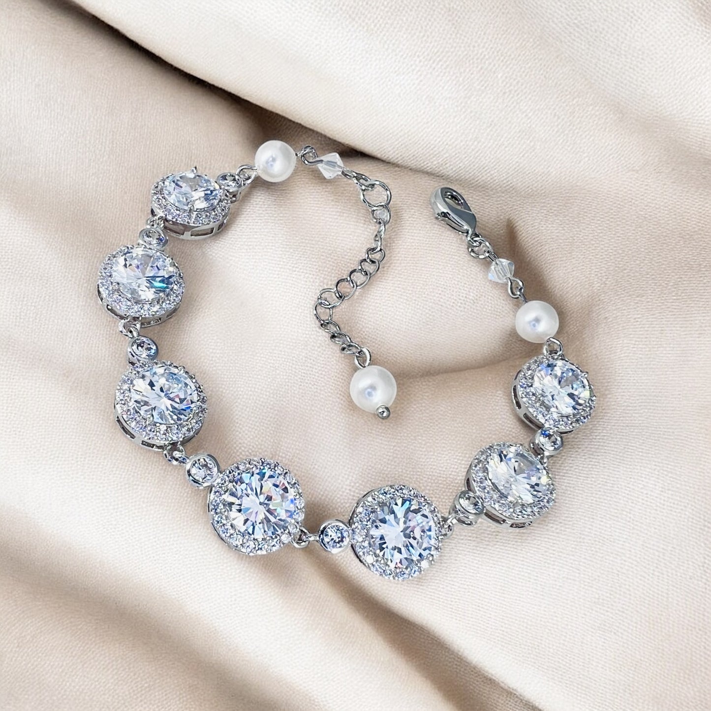 Handmade clear crystal wedding bracelet showing brilliant round cubic zirconia links and silver-tone finish