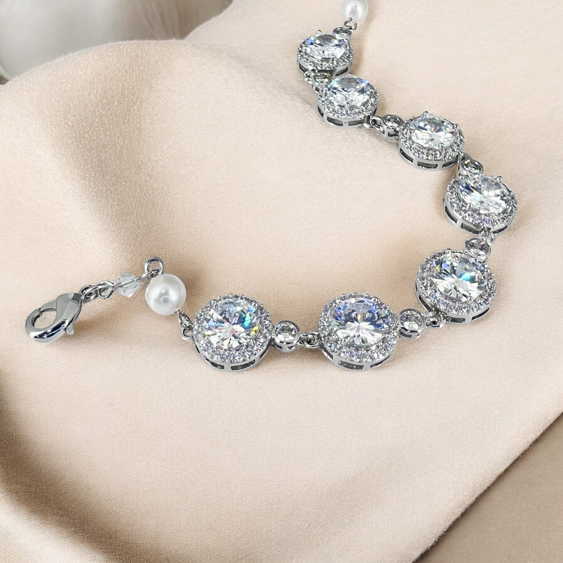 Close-up of crystal bridal bracelet highlighting detailed stone settings and elegant pearl spacer accents
