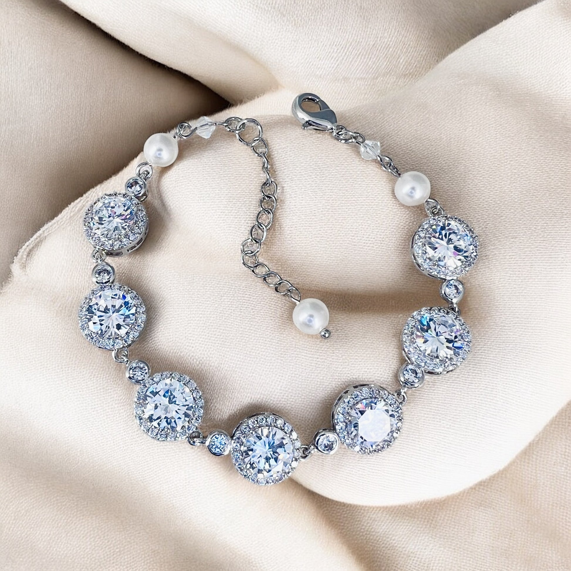 Wedding crystal tennis bracelet styled for brides, featuring high-shine round stones and adjustable chain