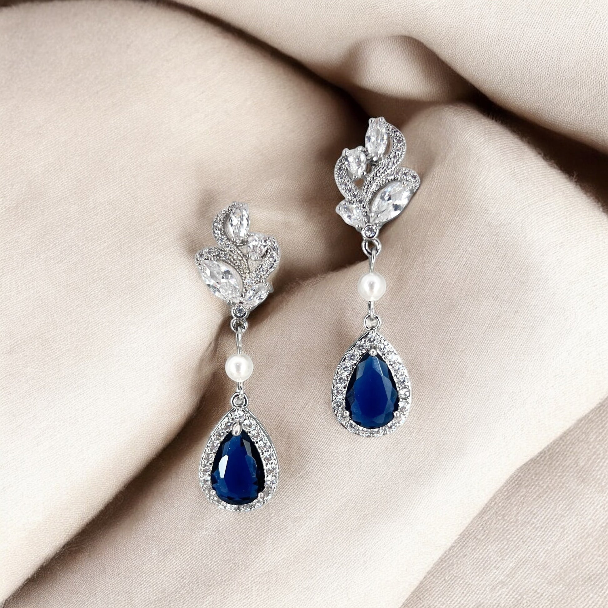 Blue crystal bridal drop earrings styled as something-blue wedding jewelry