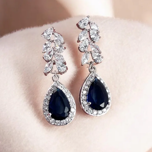 Teardrop sapphire crystal earrings with pearl detail photographed for bridal inspiration