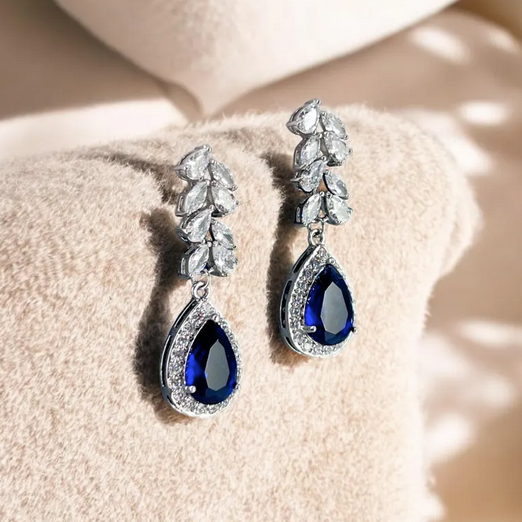 Blue crystal bridal drop earrings styled as something-blue wedding jewelry