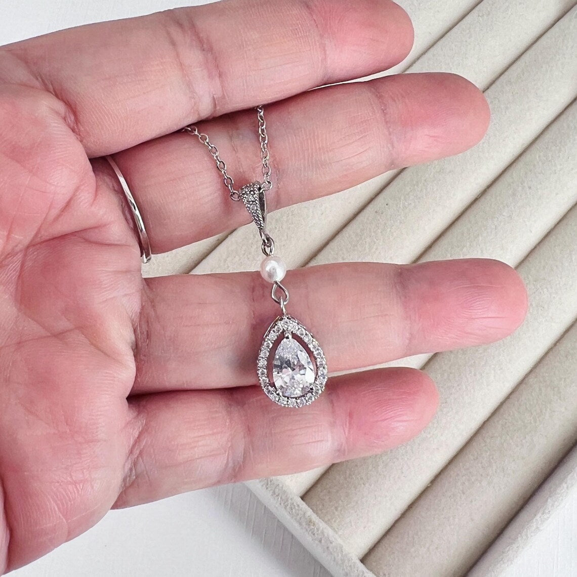 Matching crystal halo teardrop necklace with pearl accents